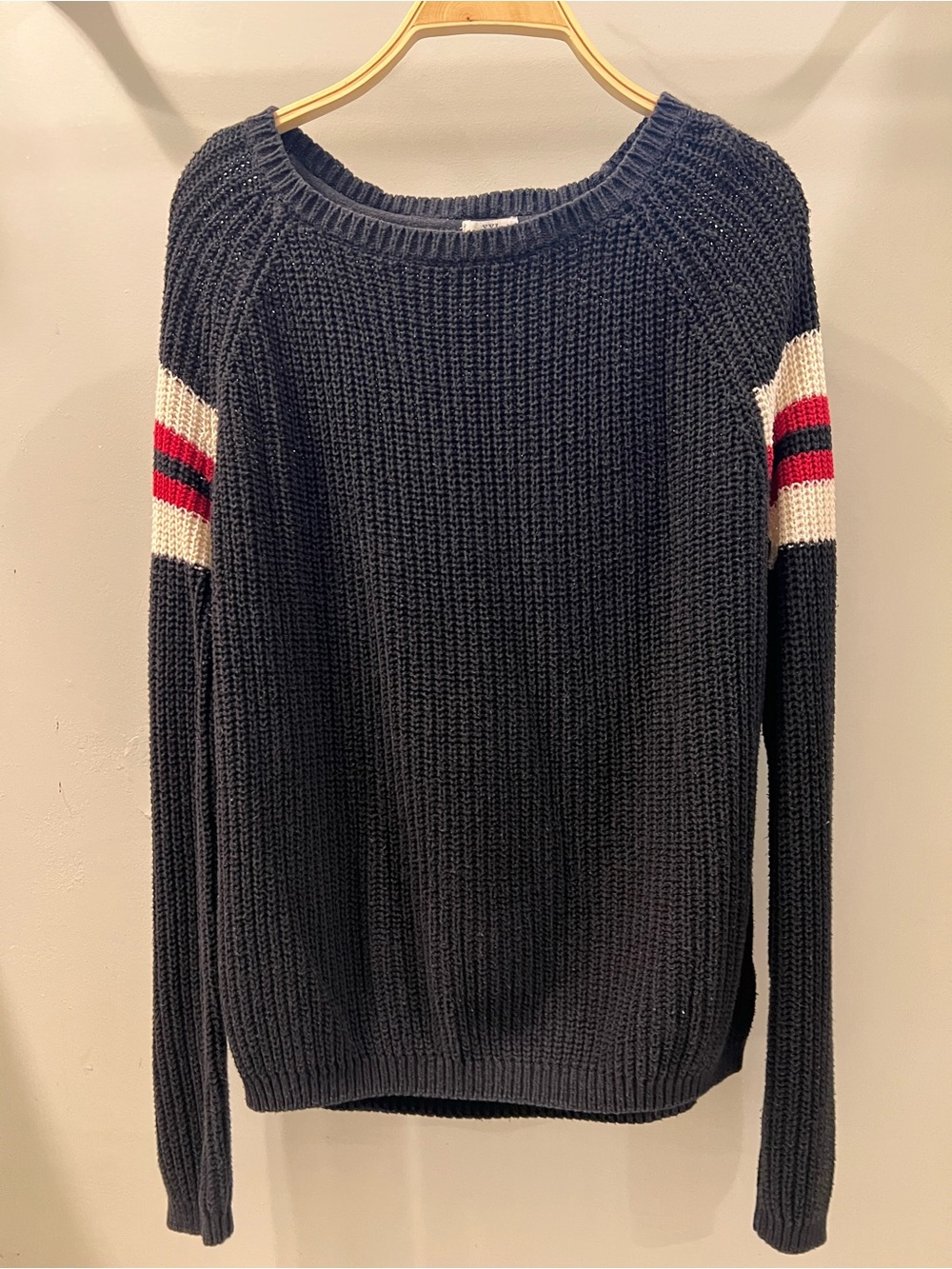 Black Knit Sweater with Cream and Red Sleeve Stripes